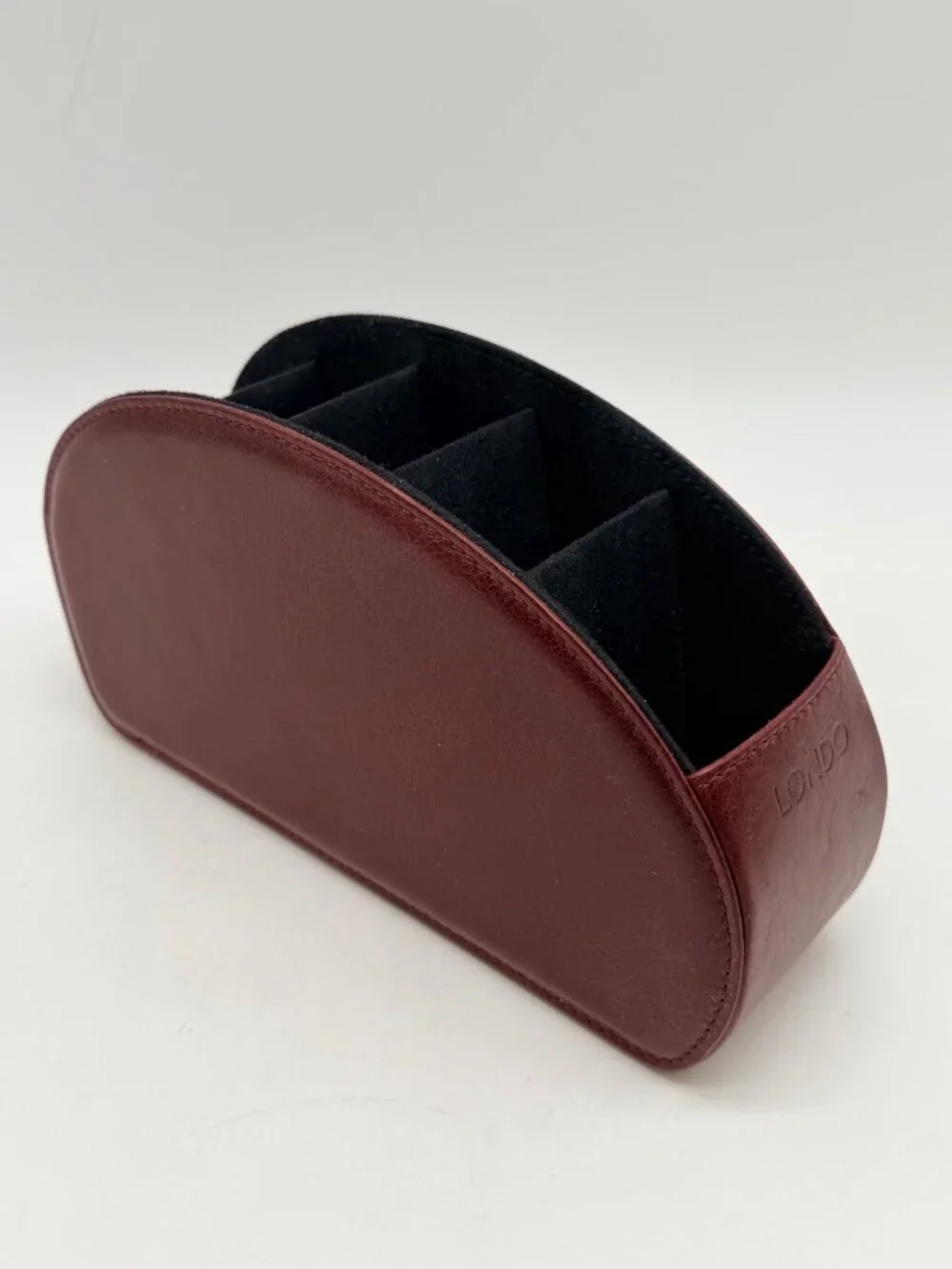 red Londo brand remote control holder features five compartments for organizatio